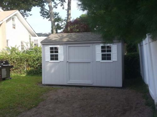 8x12 gray utility gable, 48 inch door, 2 windows, white shutters, weathered wood roof