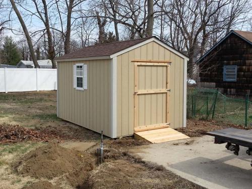 8x12 primed utility tackroom, 48 inch door, 1 window, white shutters, 48 inch ramp
